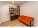 Cozy living area with a decorative cabinet and an orange sofa, perfect for a relaxing atmosphere at 341 Golan Circle # B, Myrtle Beach, SC 29579