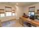 Comfortable home office with natural light, wood-look floors and a modern wood desk setup at 341 Golan Circle # B, Myrtle Beach, SC 29579
