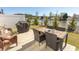 Inviting patio area with outdoor seating, grill, and peaceful water view for relaxing and entertaining at 341 Golan Circle # B, Myrtle Beach, SC 29579