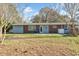 Home's exterior showcasing a brick facade, a patio area, and a well-maintained lawn at 3494 Cactus St. # 3494, Myrtle Beach, SC 29577