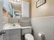 This bathroom has white walls, sink, toilet and mirror at 3494 Cactus St. # 3494, Myrtle Beach, SC 29577