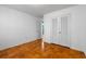 The bedroom has hardwood floors, white walls, and a double closet at 3494 Cactus St. # 3494, Myrtle Beach, SC 29577