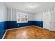This bedroom has hardwood floors, a closet and blue and white walls at 3494 Cactus St. # 3494, Myrtle Beach, SC 29577