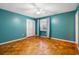 Bedroom with a fan, hardwood floors and teal walls at 3494 Cactus St. # 3494, Myrtle Beach, SC 29577