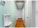 Hallway with mint green walls, parquet floors, and white doors at 3494 Cactus St. # 3494, Myrtle Beach, SC 29577