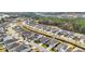 Aerial view of a residential community with tree-lined streets and sidewalks at 351 Firenze Loop, Myrtle Beach, SC 29579