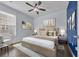 This bedroom features hardwood floors, soft natural light, and a ceiling fan at 351 Firenze Loop, Myrtle Beach, SC 29579