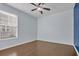 This bedroom features hardwood floors, soft natural light, and a ceiling fan at 351 Firenze Loop, Myrtle Beach, SC 29579