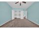Empty bedroom with open closet, blue walls, and view into the hall at 351 Firenze Loop, Myrtle Beach, SC 29579