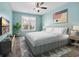 Stylish bedroom with a modern bed, vibrant artwork, and a large window with natural light at 351 Firenze Loop, Myrtle Beach, SC 29579