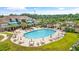 Community pool area with lounge chairs and umbrellas, perfect for relaxing and socializing at 351 Firenze Loop, Myrtle Beach, SC 29579