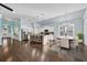 Open concept kitchen features a large center island with seating, white cabinets, and stainless appliances at 351 Firenze Loop, Myrtle Beach, SC 29579