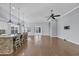 Spacious kitchen showcasing a large island with seating, modern lighting, and sliding glass doors at 351 Firenze Loop, Myrtle Beach, SC 29579