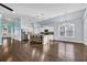 Bright, open-concept kitchen with white cabinets, a large island, and stainless steel appliances at 351 Firenze Loop, Myrtle Beach, SC 29579