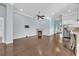 Inviting living room with hardwood floors, a cozy fireplace, and seamless access to the kitchen at 351 Firenze Loop, Myrtle Beach, SC 29579