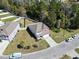 Aerial shot of a beautiful home in a suburban neighborhood, showcasing the well-manicured lawn and quiet street at 3659 White Wing Circle, Myrtle Beach, SC 29579