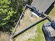 Aerial view of a fully fenced backyard, complete with a patio and fire pit for outdoor relaxation and entertaining at 3659 White Wing Circle, Myrtle Beach, SC 29579