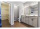 Elegant bathroom with double vanity, neutral colors, and walk in closet at 3659 White Wing Circle, Myrtle Beach, SC 29579