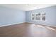 Light-filled bedroom with hardwood floors and large windows offering plenty of natural light at 3659 White Wing Circle, Myrtle Beach, SC 29579