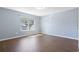 Bedroom features wood-look flooring and natural light through large window at 3659 White Wing Circle, Myrtle Beach, SC 29579