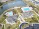Aerial view of a community pool and clubhouse, offering residents a recreational space at 3659 White Wing Circle, Myrtle Beach, SC 29579