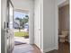 Bright foyer showcasing an open front door view, a neutral palette, and access to a convenient half bathroom at 3659 White Wing Circle, Myrtle Beach, SC 29579