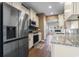 Modern kitchen featuring stainless steel appliances, granite counters, and an open layout at 3659 White Wing Circle, Myrtle Beach, SC 29579