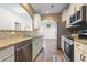 Well-equipped kitchen with stainless appliances and a large sink, perfect for cooking and entertaining at 3659 White Wing Circle, Myrtle Beach, SC 29579