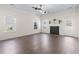 Spacious living room featuring vinyl flooring, a cozy fireplace, and abundant natural light at 3659 White Wing Circle, Myrtle Beach, SC 29579