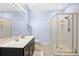 Bathroom featuring a glass shower, white walls and vanity top, and neutral flooring at 381 Da Gullah Way # 8 B, Pawleys Island, SC 29585