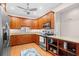Well-lit kitchen featuring custom wood cabinetry, granite counters, and stainless steel appliances at 381 Da Gullah Way # 8 B, Pawleys Island, SC 29585