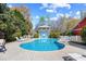 Gorgeous pool area with lounge chairs and a community building for outdoor entertaining at 381 Da Gullah Way # 8 B, Pawleys Island, SC 29585