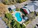 Aerial shot of sparkling kidney shaped community pool with lots of lounge chairs for relaxing at 381 Da Gullah Way # 8 B, Pawleys Island, SC 29585