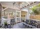 Inviting screened porch featuring comfortable seating and a ceiling fan at 381 Da Gullah Way # 8 B, Pawleys Island, SC 29585