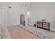 View of the bedroom with modern chandelier, dresser, and decor at 400 Cambridge Circle # L-7, Murrells Inlet, SC 29576