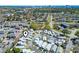 Aerial view of a residential neighborhood with tree-lined streets and community amenities at 413 Chesterfield Ct., Myrtle Beach, SC 29577