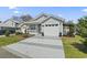 Charming home with a well-manicured lawn, white picket fence and attached garage at 413 Chesterfield Ct., Myrtle Beach, SC 29577