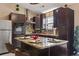 Kitchen with island, granite countertops, stainless steel appliances, and tile backsplash at 413 Chesterfield Ct., Myrtle Beach, SC 29577