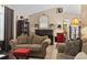 Cozy living room with a fireplace, neutral walls, tile floors and classic furnishings at 413 Chesterfield Ct., Myrtle Beach, SC 29577