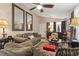 Cozy living room with comfortable seating, ceiling fan and decorative mirrors at 413 Chesterfield Ct., Myrtle Beach, SC 29577