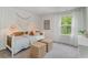 Cozy bedroom featuring natural light, stylish furnishings and woven wicker accents at 414 Acosta Circle, Conway, SC 29527