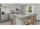 Modern kitchen featuring gray cabinets, stainless steel appliances, granite countertops, and a spacious island at 414 Acosta Circle, Conway, SC 29527