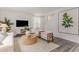 Comfortable living room with neutral tones, stylish furniture, a television, and a large framed artwork at 414 Acosta Circle, Conway, SC 29527