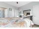 Bedroom featuring a bed with a patterned quilt, dresser, and ensuite bathroom at 4141 Hibiscus Dr. # 201, Little River, SC 29566