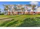 Condo building with grassy lawn, private balconies and attractive architectural details at 4141 Hibiscus Dr. # 201, Little River, SC 29566