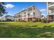 Condo building features grassy lawns, private balconies and attractive architectural details at 4141 Hibiscus Dr. # 201, Little River, SC 29566