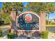Community welcome sign featuring 'The Gardens at Cypress Bay' surrounded by lush greenery at 4141 Hibiscus Dr. # 201, Little River, SC 29566