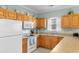 Charming kitchen featuring wooden cabinets, and modern appliances at 4141 Hibiscus Dr. # 201, Little River, SC 29566