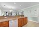 View of kitchen area featuring wooden cabinets and views to living areas at 4141 Hibiscus Dr. # 201, Little River, SC 29566