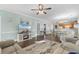 An open-concept living room featuring a large sectional, eat-in kitchen and modern décor at 4141 Hibiscus Dr. # 201, Little River, SC 29566